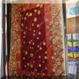 R93. Contemporary red ground wool rug.